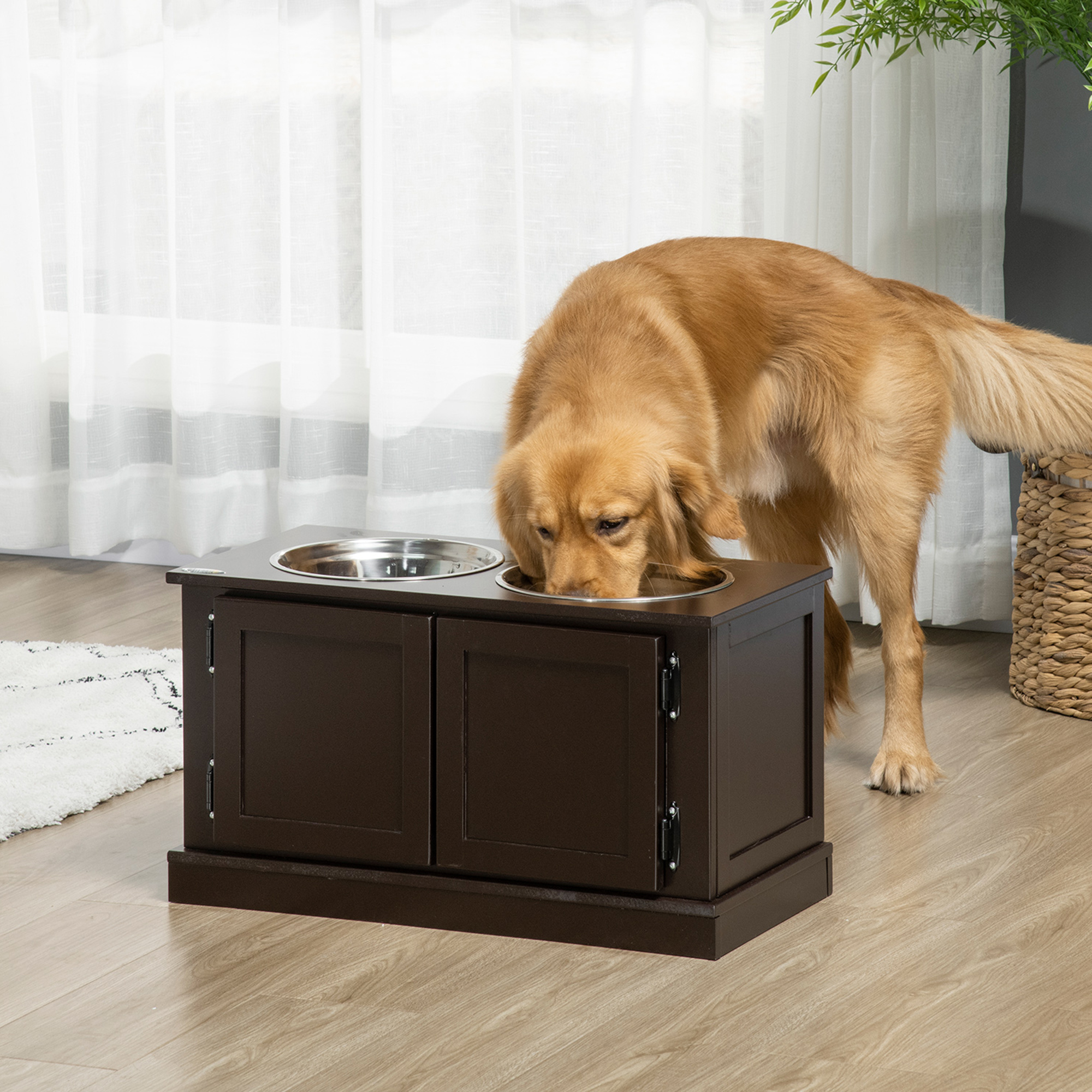 Large dog eating from an elevated dog bowl stand with built-in storage cabinet in coffee-brown MDF wood. {{brizy_dc_image_alt imageSrc=